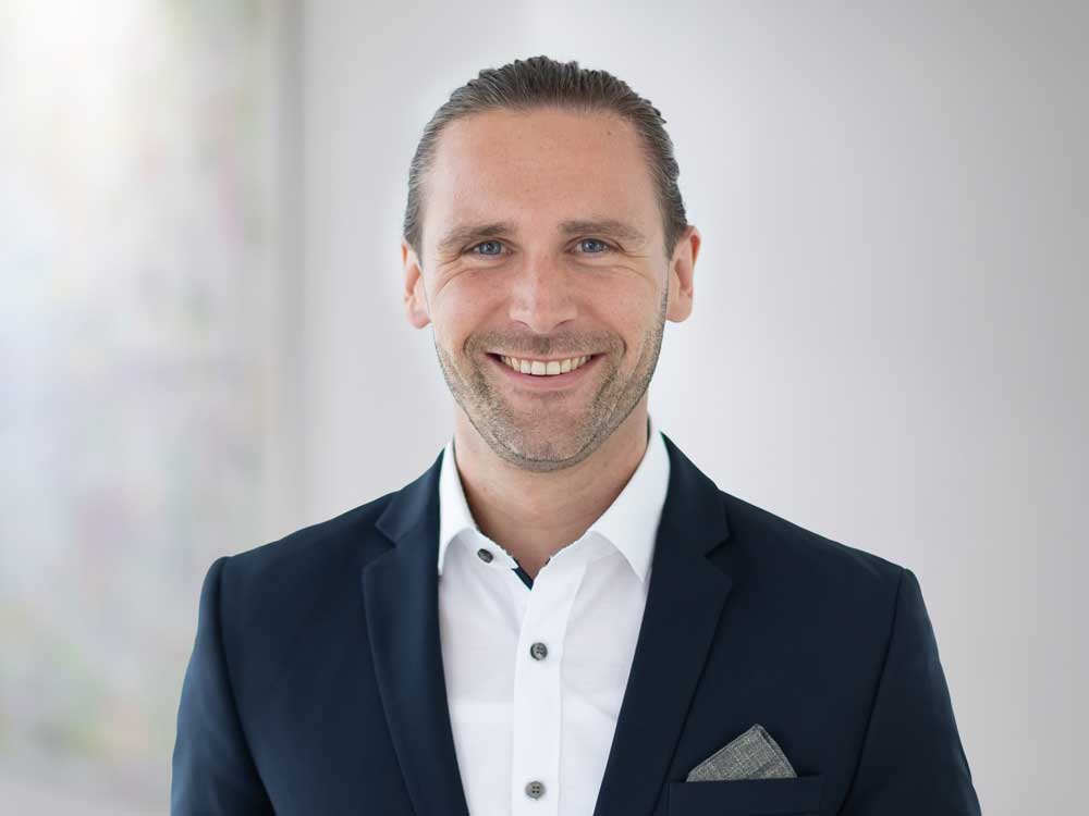 Porträt von Raphael Schmitz. Leiter Produkt- & Vertriebsmanagement – LAUREUS AG PRIVAT FINANZ